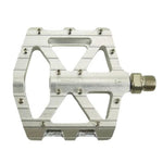 The SD CNC V2 Junior/Expert Pedals are silver metal bike pedals with a wide flat platform, visible grip pins, and a threaded spindle. Built with CNC alloy and precision sealed bearings for smooth riding performance.
