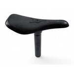 The SD Seat Revolt is a black seat with a textured surface and attached seat post, displayed against a plain white background—ideal as a versatile bike seat combo for any ride.