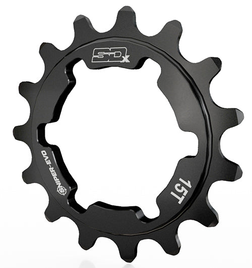 The SD-X Sniper Evo Cog Alloy Black is a black 15T BMX racing cog made from durable 7075 aluminium, featuring engraved text, an irregular-edged central cutout, and compatibility with Sniper Evo rear hubs.