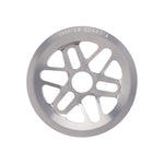 The Odyssey La Guardia Bolt Drive Sprocket is a silver BMX sprocket with eight cutout spokes and "ODSY LA GUARDIA" engraved on the top edge, featuring full guard protection.