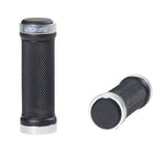 Two black and silver Sinz Mini Lock On BMX Grips with textured surfaces—one upright, one lying down—offer a secure hold and are perfect for your race bike.