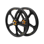 Two black five-spoke Skyway TUFF II 60th Anniversary 20 Inch wheels with orange hubs, made of durable Zytel Nylon, are positioned side by side against a white background.