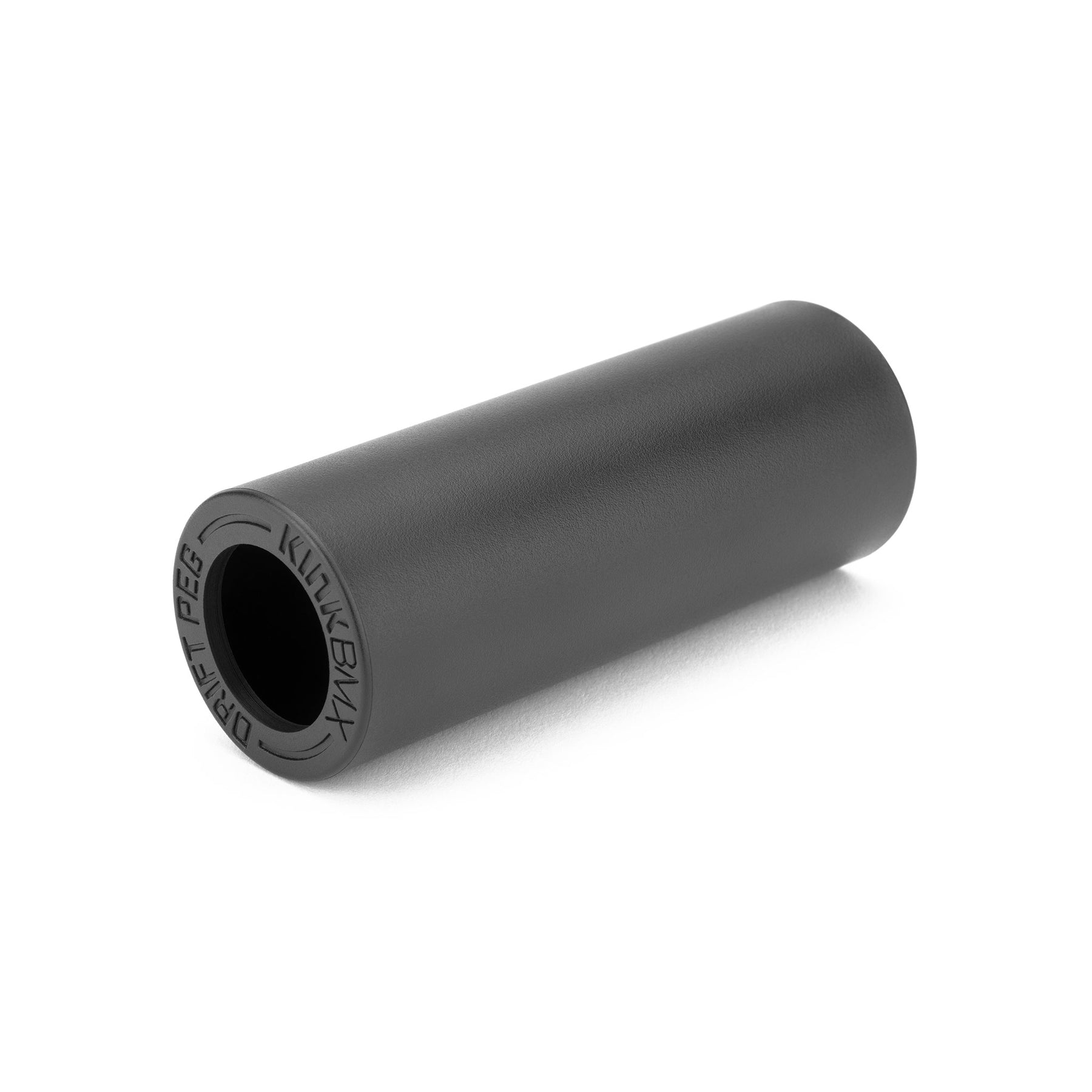 A black cylindrical Kink Drift Peg Sleeve (sleeve only) with "KINK BMX" and "DRIFT PEG" embossed on one end, shown on a white background—perfect as a replacement or for pairing with a Kink Drift peg.
