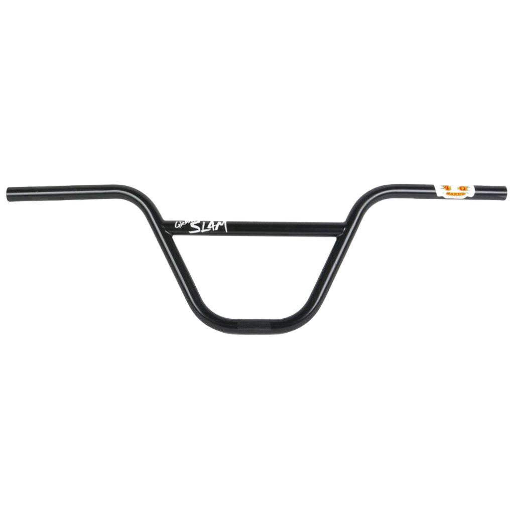 The S&M Grand Slam Bars are black BMX handlebars made from durable 4130 CrMo steel, featuring a crossbar and logo on the side, elegantly set against a plain white background.