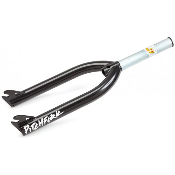 The S&M Pitchfork Shoop Soiled is a black and silver 4130 CrMo BMX fork featuring "PITCHFORK" in white on one leg, a logo sticker on the steerer tube, and USA-made quality.