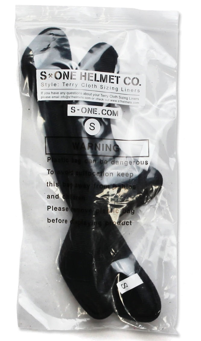 A pair of black gloves with S-One Lifer Helmet Liners in a plastic bag.