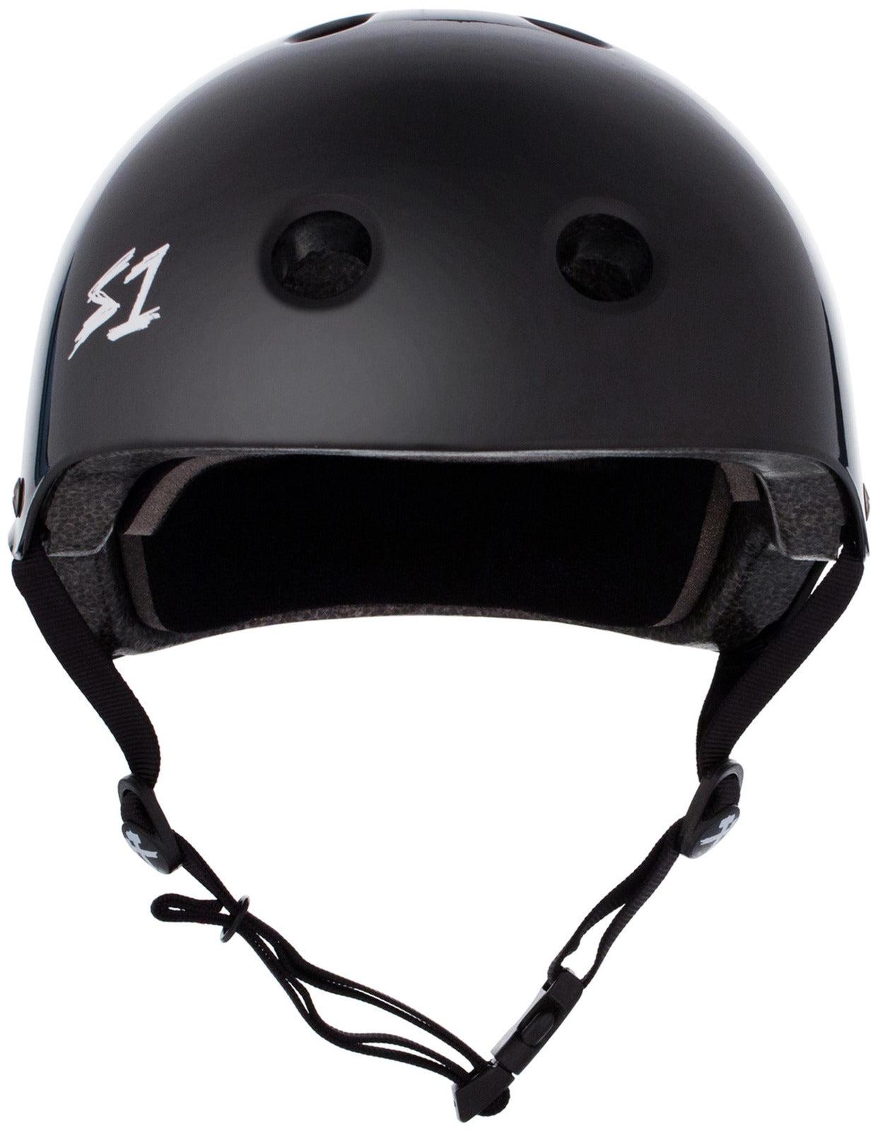 The Australian-certified S-One Helmet Lifer Black Gloss is a black protective headgear featuring ventilation holes and an adjustable chin strap. It sports a white "S1" logo on the front left, ensuring both safety and style.