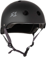 The S-One Lifer Helmet in black matte with grey straps features ventilation holes, an adjustable chin strap, a certified skate helmet design, and side "S1" logo for multiple impact protection.