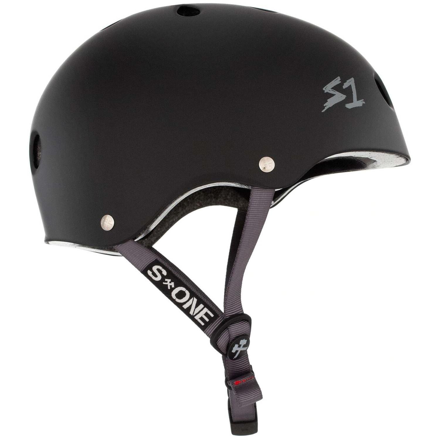 The S-One Lifer Helmet in Black Matte with grey straps features ventilation holes, an adjustable chin strap, the S1 logo on the side, and is certified for multiple impact protection for enhanced safety.
