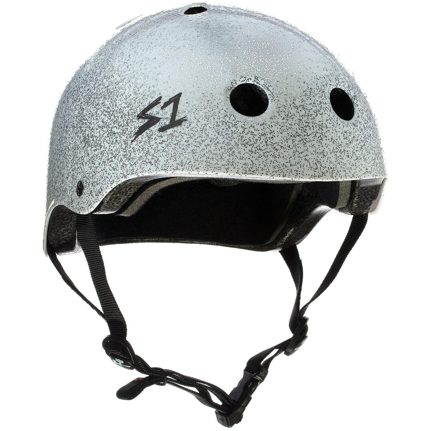The S-One Lifer Helmet in White Glitter features black padding, ventilation holes, an adjustable chin strap, and a side "S1" logo. Designed for action sports, it offers multi-impact protection for superior safety.