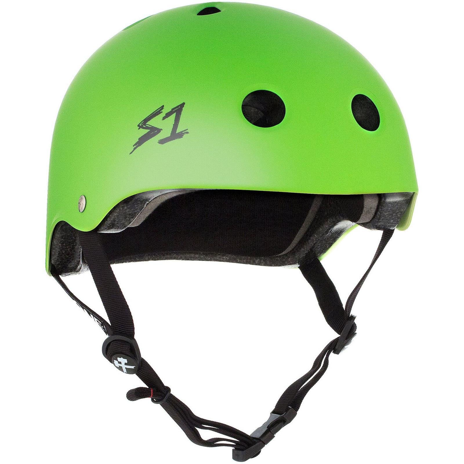 The S-One Lifer Helmet in Bright Green Matte has black straps, a chin buckle, ventilation holes, and a stylized "S1" logo. This certified skate helmet provides reliable multi-impact protection for safety.