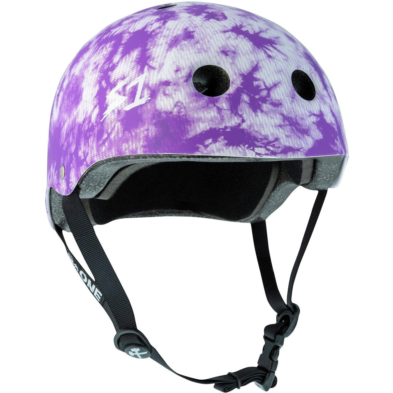 The S-One Lifer Helmet in Purple Tie Dye features black straps, ventilation holes, and certified multi-impact skate helmet safety.