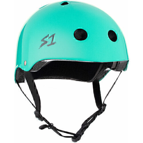 The S-One Helmet Lifer Lagoon Gloss features ventilation holes, black adjustable straps, and an "S1" logo on the side. This high-impact, Australian-certified helmet delivers reliable protection for skating enthusiasts.