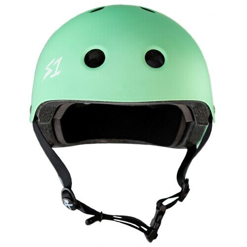 The S-One Helmet Lifer Mint Green Matte features ventilation holes, black padding, and an adjustable chin strap. Photographed on a white background, this Australian-certified helmet delivers premium protection for every skate session.