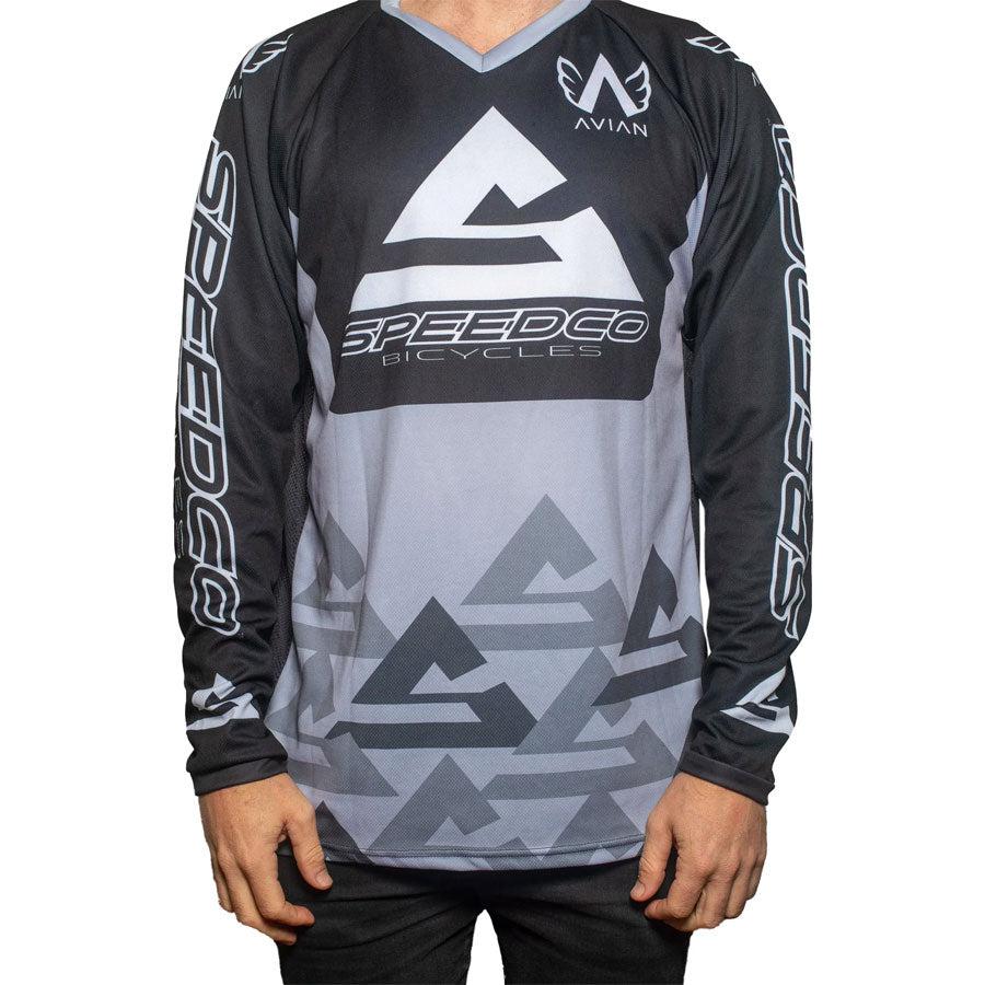 A man sporting a Speedco Race Jersey in shades of grey and black.