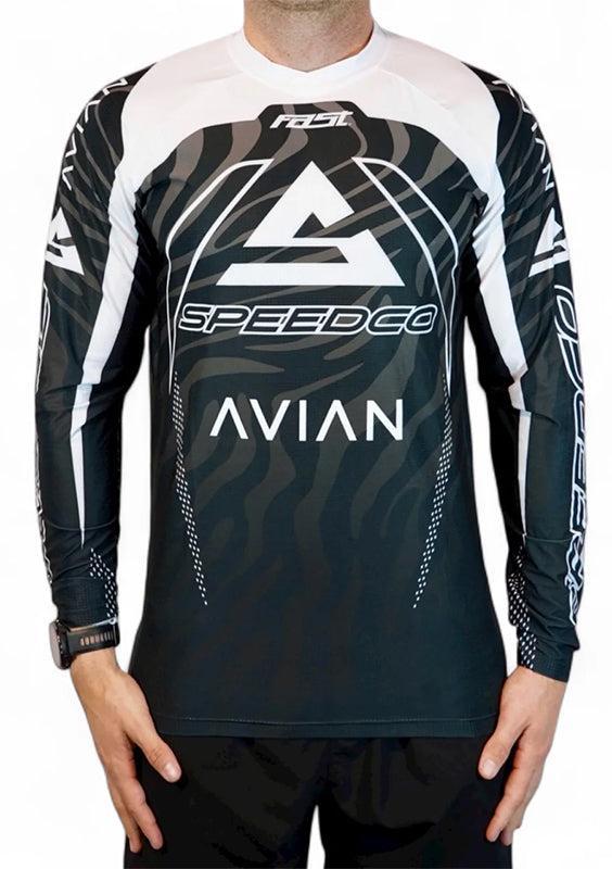 A person wears the Speedco / Avian Race Jersey, a black and white aerodynamic top with "SPEEDCO" and "AVIAN" logos plus bold geometric and wave patterns—ideal for race day.