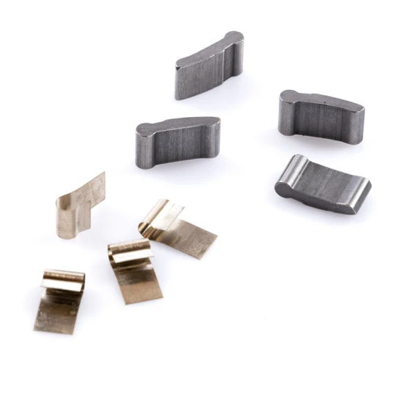 Six metallic components—three curved weights and three folded spring clips—from the Federal Stance Pro Pawl and Spring Kit are arranged on a white surface.