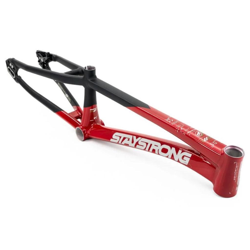The Staystrong V5 Disc Pro XXXXL Frame is a red and black aluminium BMX race frame with “STAY STRONG” written in white letters on the side, featuring disc brake compatibility and shown on a white background.