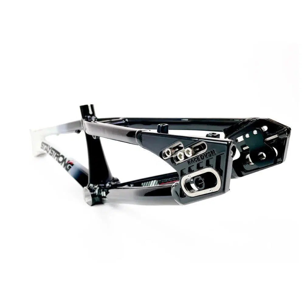 A black and white Staystrong V5 Disc Pro Cruiser Frame positioned at an angle, showcasing the rear dropouts and some branded decals, made from 6061 alloy tubing.