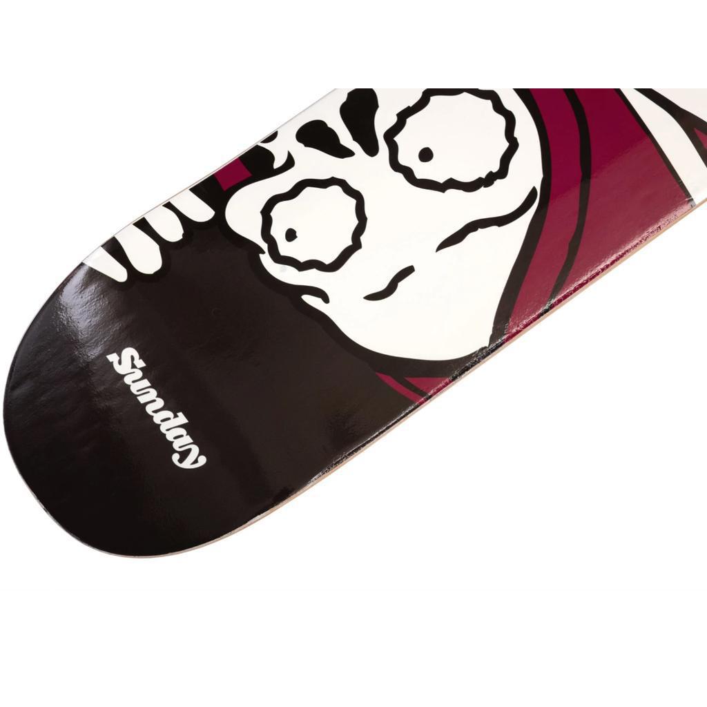 The Sunday Creepy Sweeper Skateboard Deck features a wide-eyed cartoon skull in black and white, prominently displaying "Sunday" on a dark background. Made from high-quality Canadian Hard Rock Maple, it's durable and visually striking—ideal for your next skate session.