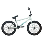 The Sunday EX Julian Arteaga 20 Inch Bike is shown in profile with a white frame, black tires, pedals, and handlebars. This signature model features a 100% chromoly frame for enhanced durability and style against a plain white background.