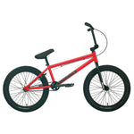 A Sunday Primer 20 Inch Bike in red, featuring a black seat, black handlebars, and black tires, set against a plain white background. This bike boasts pro-level geometry in its simple, minimalist design with no additional accessories.