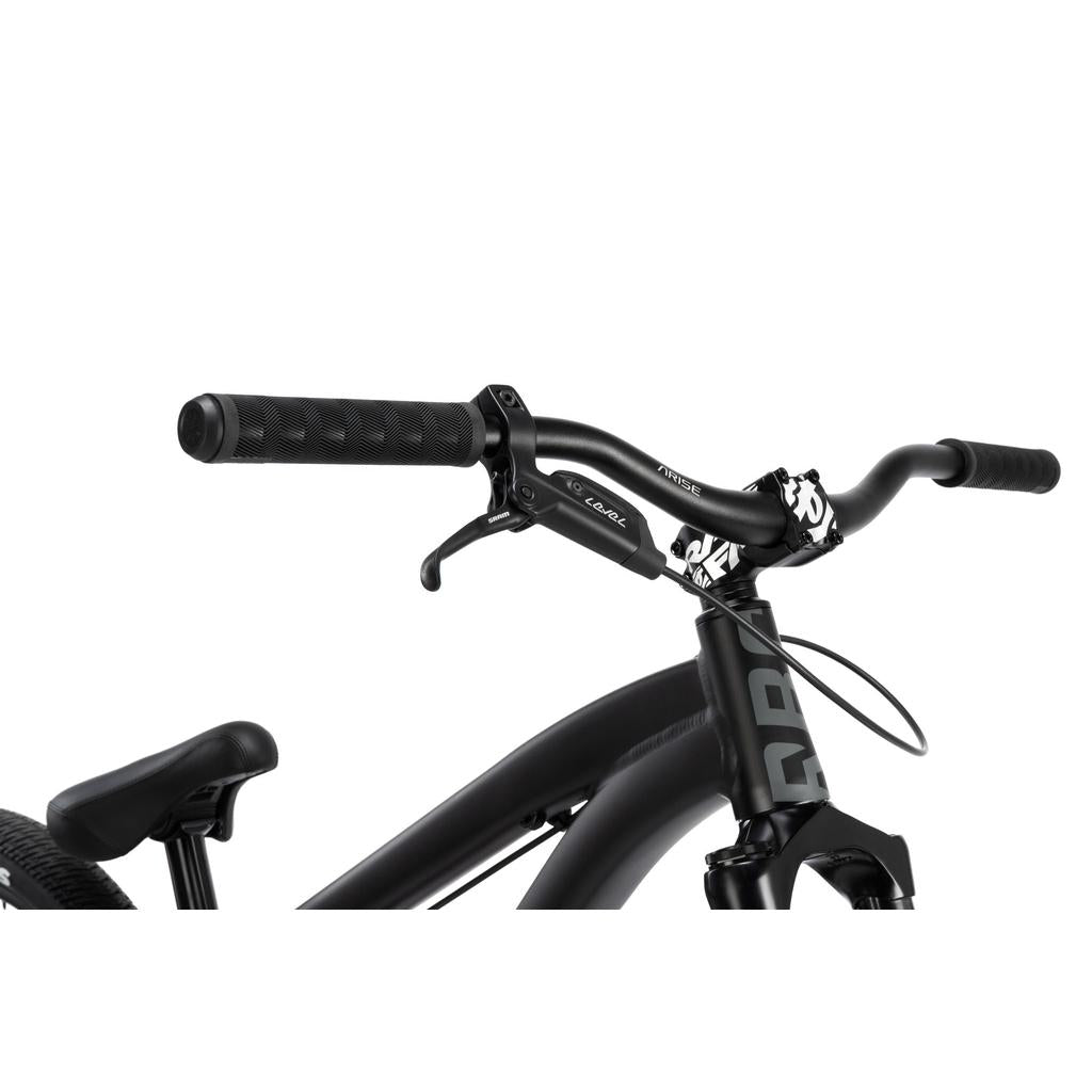 Close-up of the Radio 26 Inch Griffin Pro Bike's black handlebars, brake lever, alloy frame, and seat against a white background.