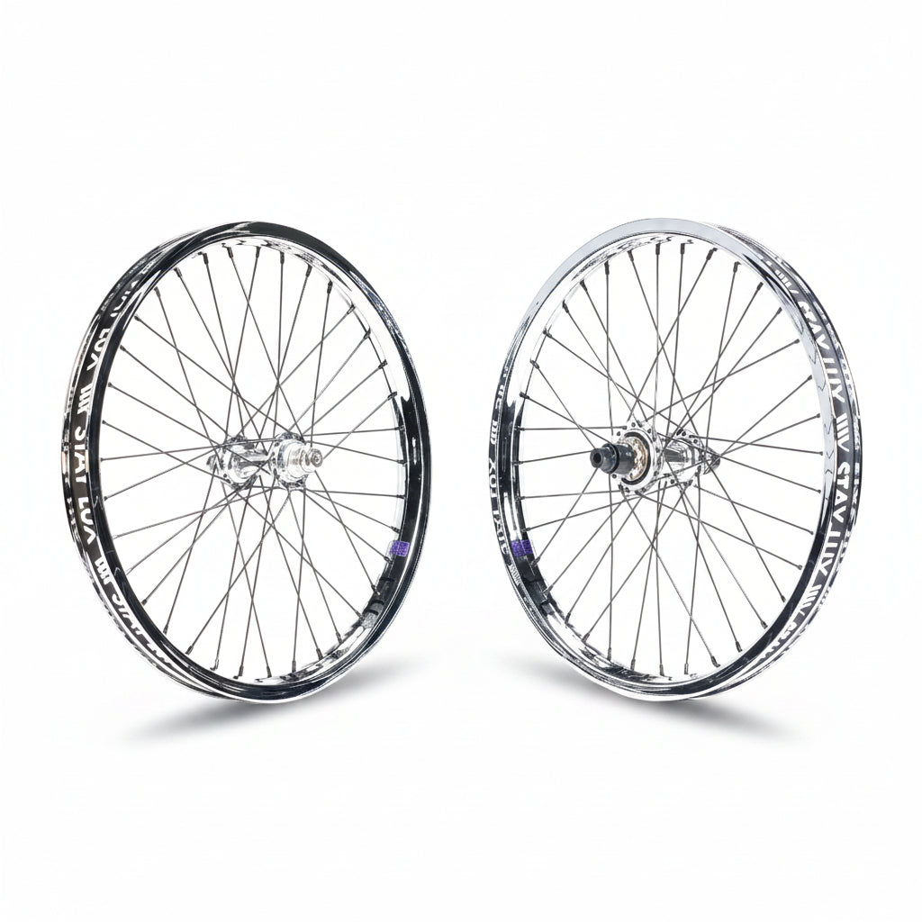 The Tall Order X Birdcage Custom Wheelset features two metal-spoked wheels with black-and-silver rims, standing upright on a white background—ideal for BMX bikes or as a custom upgrade.