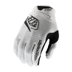 The TLD 25.1 Air Glove Mono White features micro-mesh ventilation in a white and black design, with a logo on the back and "Troy Lee Designs" elegantly inscribed on the wrist.