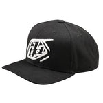 The TLD 25.1 Badge Curved Hat is a black snapback with a white embroidered logo, featuring an adjustable closure for a perfect fit. This stylish cap captures the essence of Troy Lee Designs, combining comfort and flair in one sleek accessory.