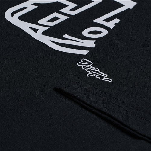 Detailed close-up of the TLD 25.1 Badge SS T-Shirt in black with white cursive "Design" text and graphics, making it a standout addition to any wardrobe.