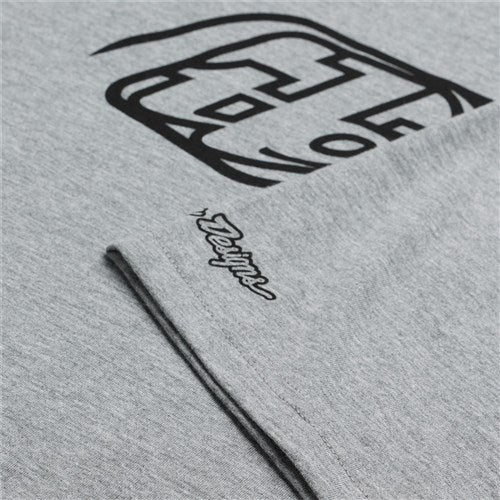 The TLD 25.1 Badge SS T-Shirt features grey fabric with a black abstract design similar to a Banger tee, and "Designs" in stylized script at the corner.