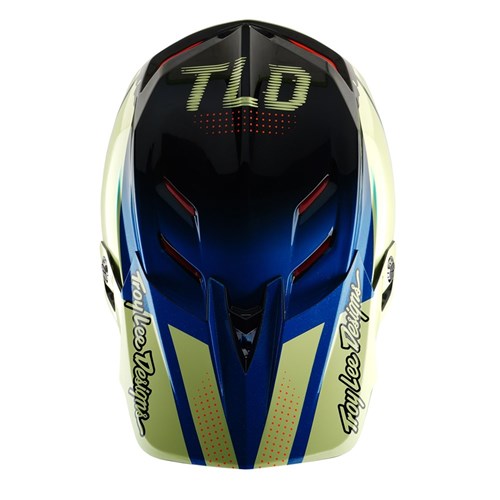 Top view of the TLD 25.1 D4 Composite Helmet (MIPS) in Glo Yellow with "TLD" and "Troy Lee Designs" logos, featuring aerodynamic lines, ventilation ports, and Mips protection to enhance safety.