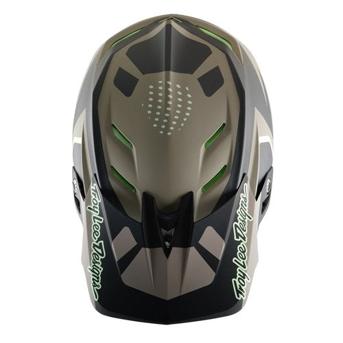 The TLD 25.1 D4 Composite Helmet (MIPS) / Optic Timber features a gray and black full-face design with green accents, ventilation holes, "Troy Lee Designs" logos on the sides, and integrated MIPS protection for added safety—perfect for downhill enthusiasts.