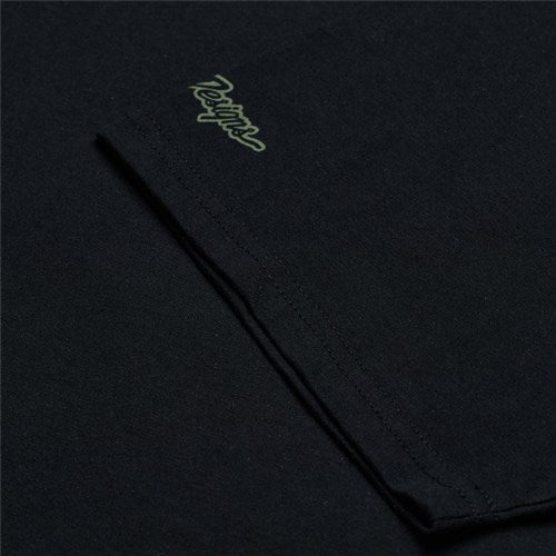 A close-up of the black TLD 25.1 Peace Out T-Shirt shows "belief" embroidered near the sleeve, capturing the essence of good vibes.
