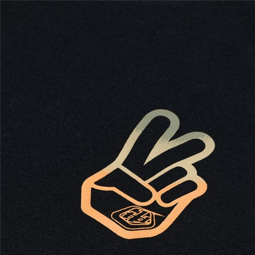The TLD 25.1 Peace Out T-Shirt is a black shirt featuring a vibrant peace-sign hand graphic with gradient orange to yellow hues, radiating good vibes.