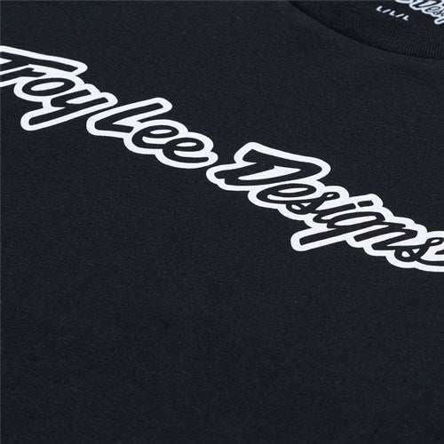 The TLD 25.1 Signature LS Shirt features "Troy Lee Designs" in a stylized white font on black fabric, perfect for adding TLD flair to your winter wardrobe.
