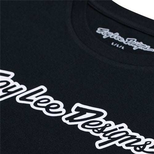 The TLD 25.1 Signature SS T-Shirt is a stylish black tee featuring "Troy Lee Designs" in white script on the chest, epitomizing the brand's epic flair.