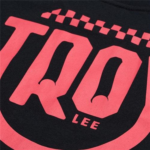 Close-up of the TLD 25.1 Smiley SS T-Shirt, a black tee with large red "TRO" lettering and smaller "LEE" text below. Its vibrant red checkered pattern adds style and cheer to your wardrobe.