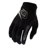 The TLD 25.1 Youth Air Glove Mono Black, featuring gray patterns and "Troy Lee Designs" logos, is displayed palm-side down to showcase its micro-mesh ventilation for excellent airflow.