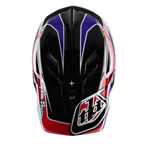The TLD D4 Polyacrylite Helmet (MIPS) in Linear Black features a vibrant design with red, white, and blue patterns, plus "Troy Lee Designs" on the side. It ensures top-notch safety with Mips Brain Protection.