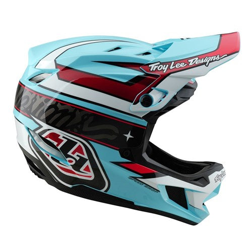 The TLD D4 Polyacrylite Helmet (MIPS) / Linear Blue is a full-face motocross helmet in blue, red, and white with bold graphics, ventilation slots, and "Troy Lee Designs" printed on it. It includes the advanced Mips® C2 brain protection system.