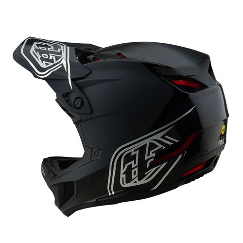The TLD D4 Polyacrylite Helmet (MIPS) in Shadow Black is a full-face helmet with a polyacrylite shell, featuring white geometric patterns. It includes Mips® C2 brain protection tech for side-view safety and strategic vents for optimal airflow, combining modern style with functionality.