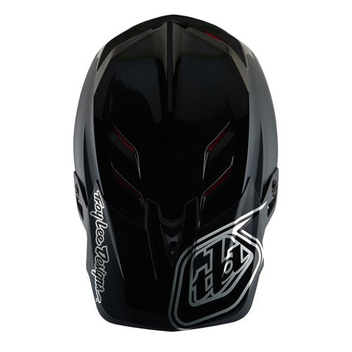 The TLD D4 Polyacrylite Helmet (MIPS) in Shadow Black showcases a black full-face design with an angular polyacrylite shell, white "Troy Lee Designs" text, a stylized side logo, and MIPS technology for enhanced brain protection.