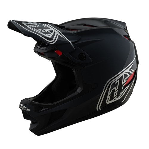 The TLD D4 Polyacrylite Helmet (MIPS) in Shadow Black features a polyacrylite shell, white and red graphics, a visor, and full-face coverage.