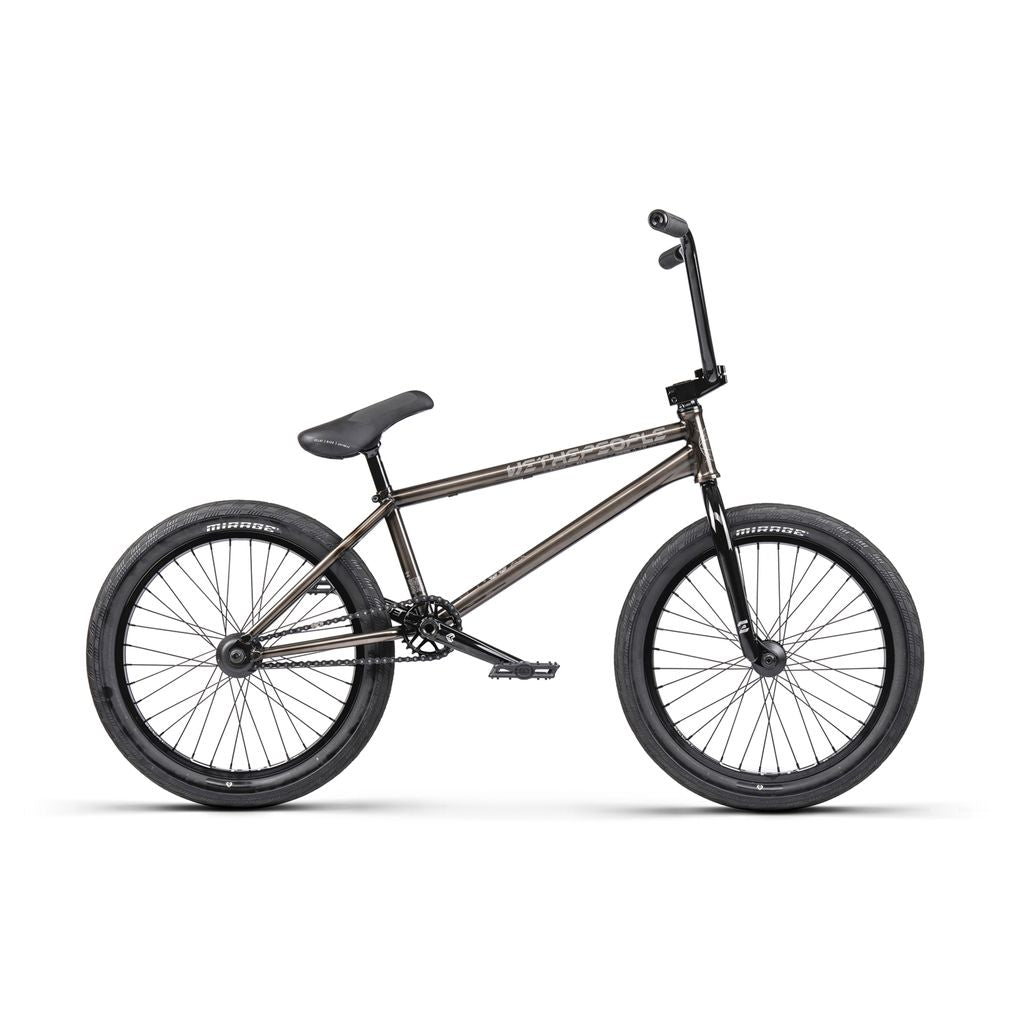 The Wethepeople Envy 20 Inch Bike, a BMX masterpiece, features thick tires, straight handlebars, and a sleek black frame on a white backdrop. With Eclat Tibia Cranks, it offers top-notch performance and style in one exceptional package.