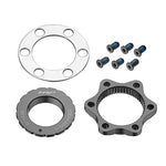 A silver metal disc compression-plate with four holes, a black circular gear labeled "TRP," a black star-shaped gear, and six screws from the TRP Centerlock ISO Adapter Kit - External Tool type are arranged on a white background.