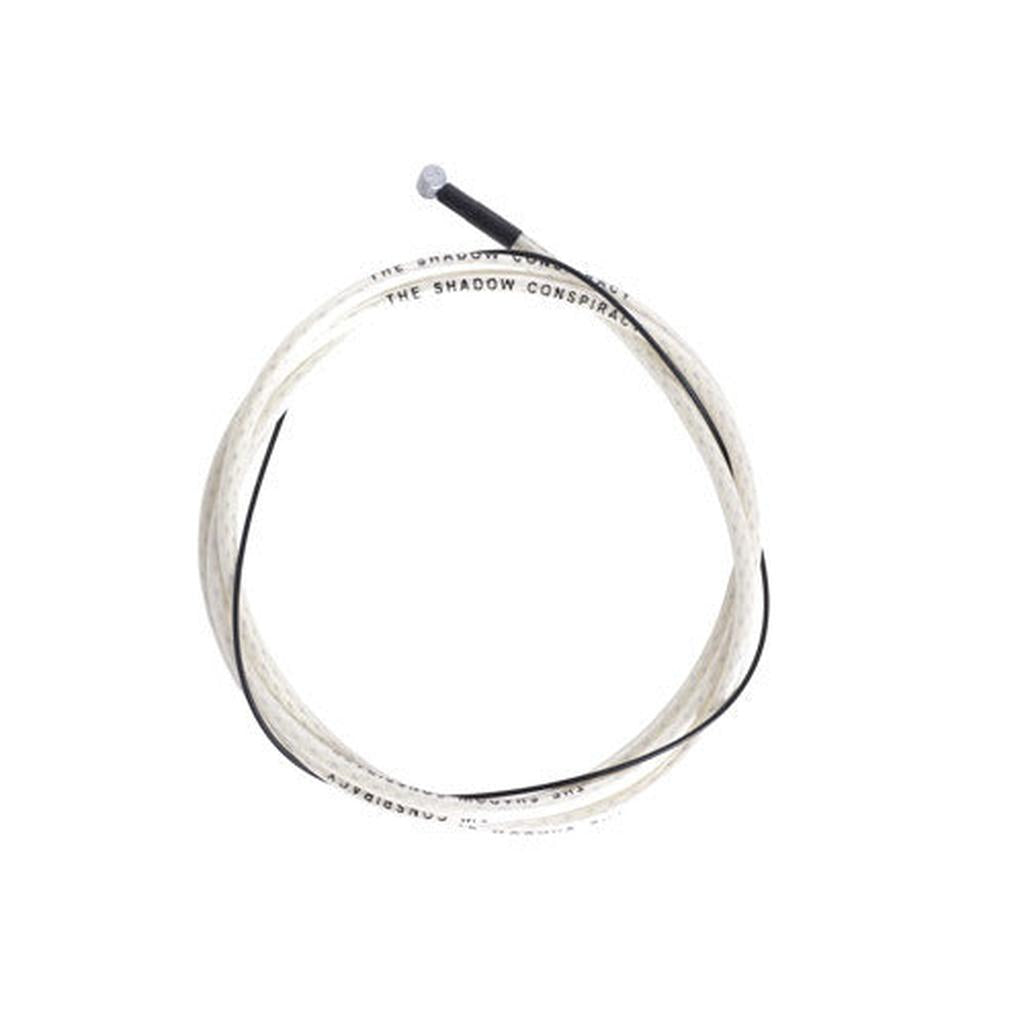 Coiled Shadow Linear Brake Cable, Clear in a housing with black lettering.