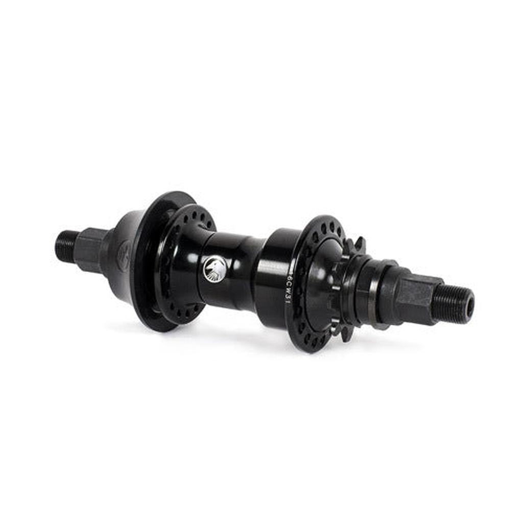 Shadow Symbol Cassette Hub BMX rear hub with spoke flange holes, threaded axle ends, central manufacturer logo, and plastic hub guard, isolated on a white background.