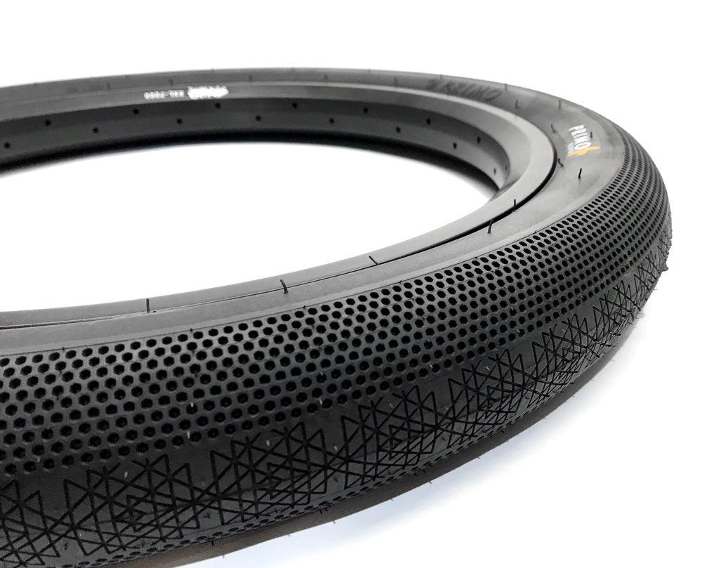 A close-up of the Primo Richter 20 Inch Folding Tyre (20x2.4), showcasing its textured, perforated surface and patterned tread, with a lightweight folding Kevlar bead, displayed on a white background.